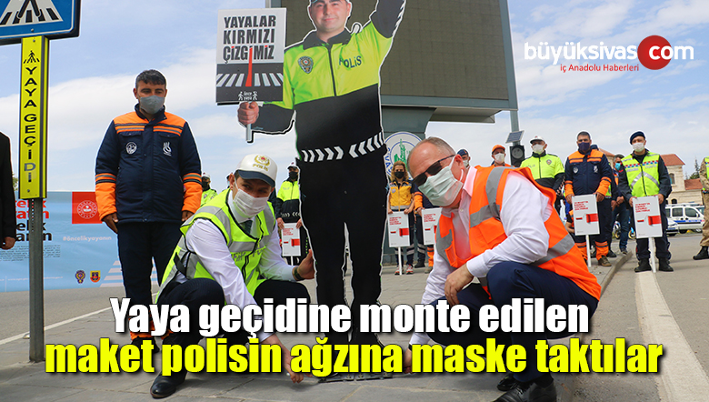 Yaya geçidine monte edilen maket polisin ağzına maske taktılar