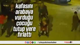 Kafasını arabaya vurduğu çocuğu tutup yere fırlattı